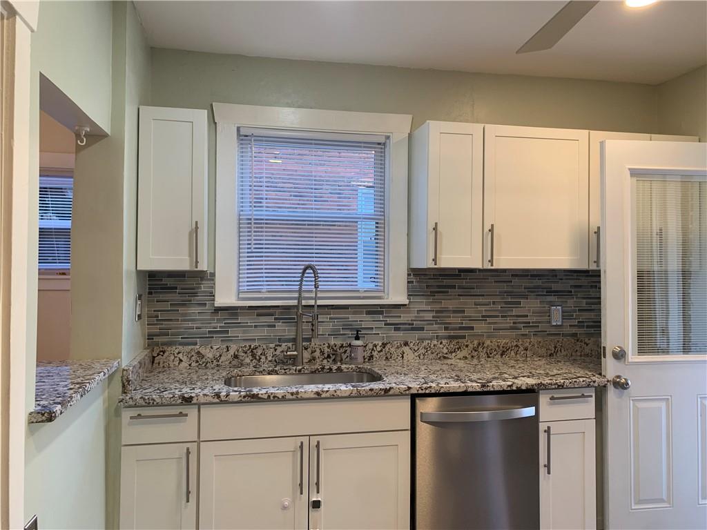 2607 Shady Avenue Pittsburgh, PA 15217 - Photo 7 of 19 a kitchen with granite countertop a sink and cabinets