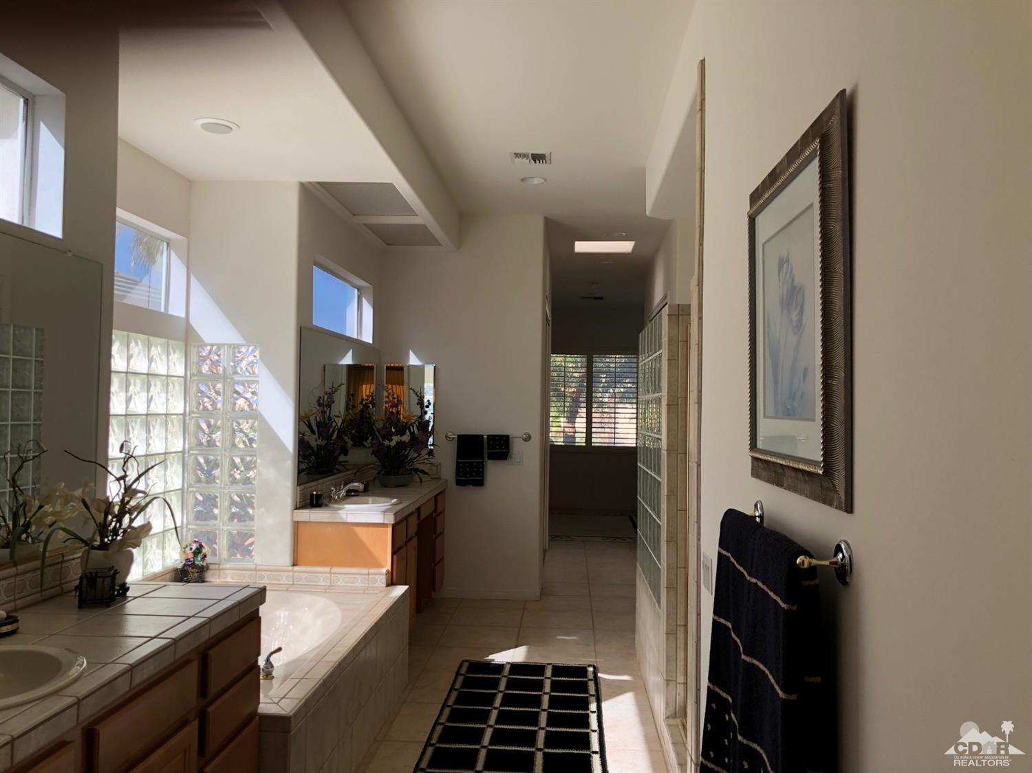 36626 Tallowood Drive Palm Desert, CA 92211 - Photo 13 of 17 a kitchen with a refrigerator and a stove top oven