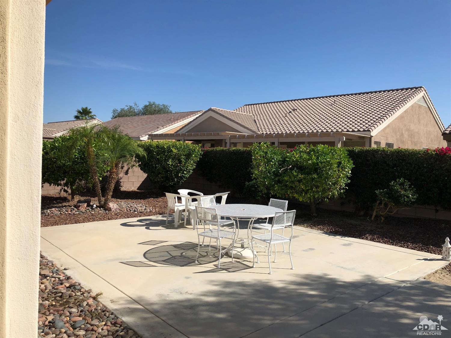 36626 Tallowood Drive Palm Desert, CA 92211 - Photo 17 of 17 a view of a house with backyard and sitting area