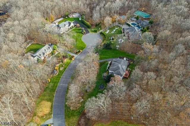 a backyard of a house with a yard with outdoor seating