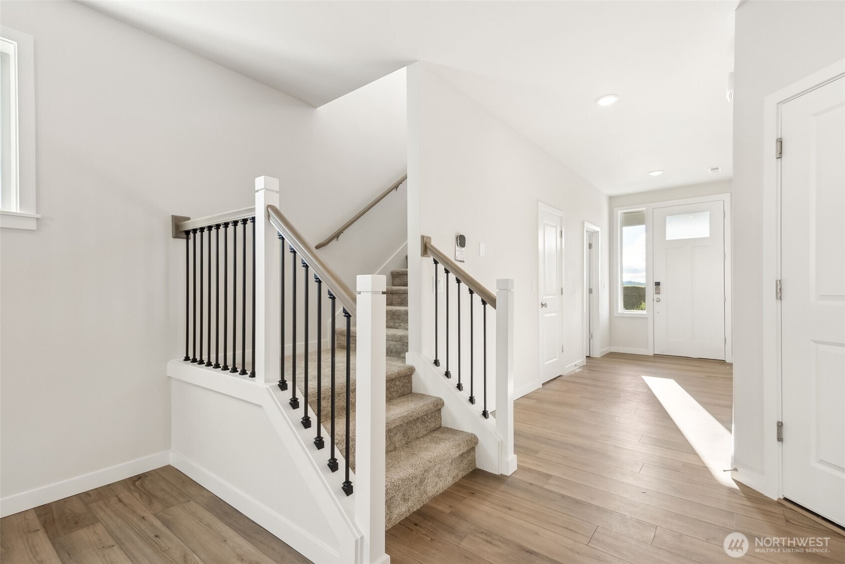 2064 Northeast Norseman Way Poulsbo, WA 98370 - Photo 15 of 28 a view of a hallway with wooden floor and entryway