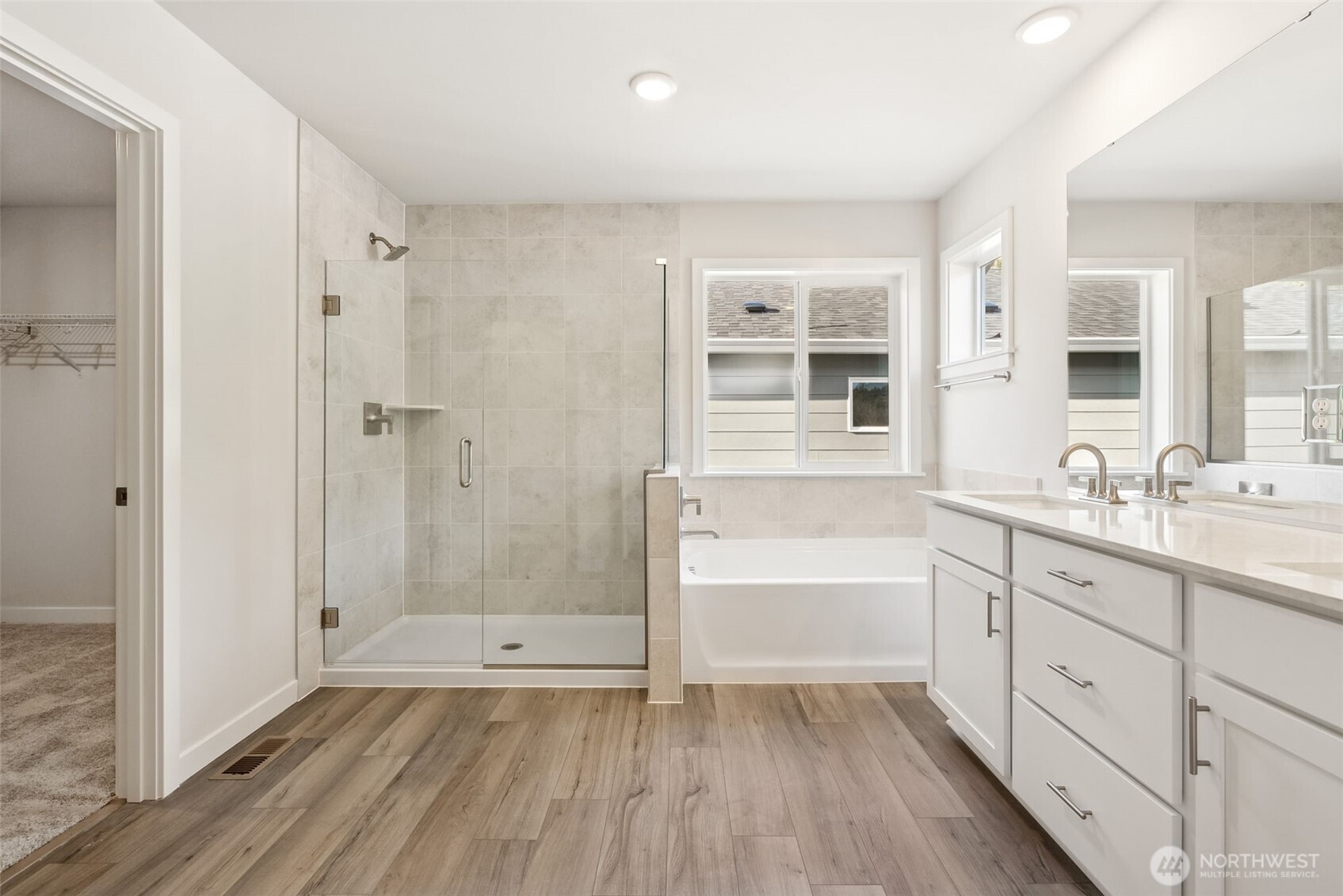 2064 Northeast Norseman Way Poulsbo, WA 98370 - Photo 23 of 28 a bathroom with a sink a mirror and a bathtub
