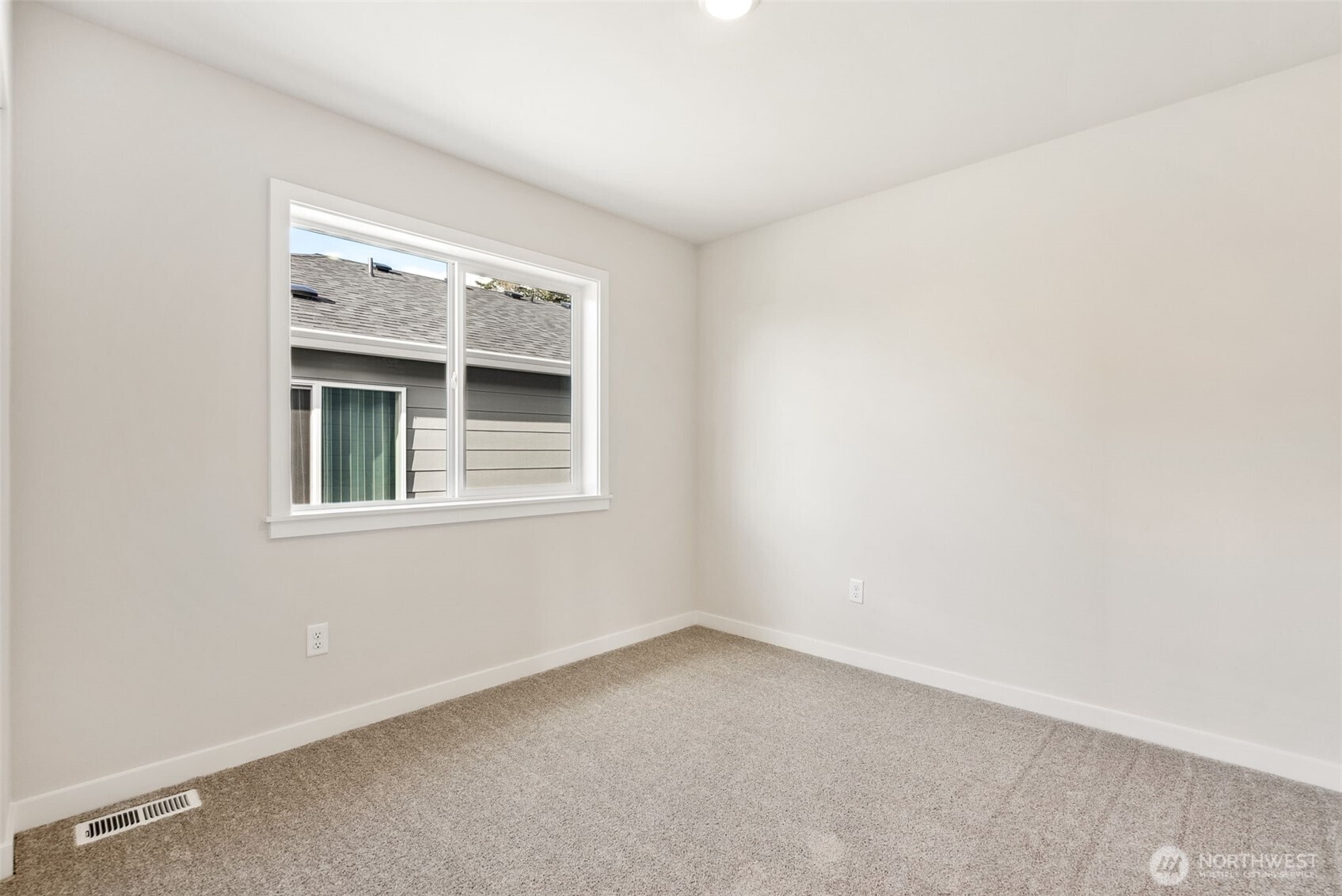 2064 Northeast Norseman Way Poulsbo, WA 98370 - Photo 28 of 28 an empty room with a window