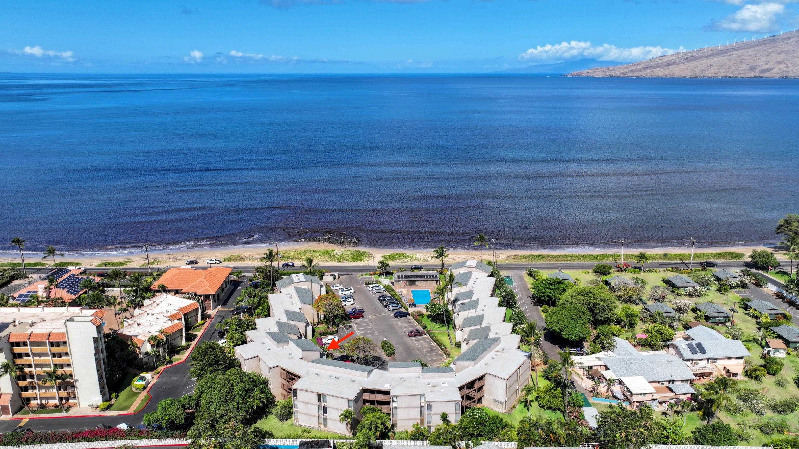 483 South Kihei Road, Unit 115 Kihei, HI 96753 - Photo 1 of 36 a view of a swimming pool with an outdoor space and seating area