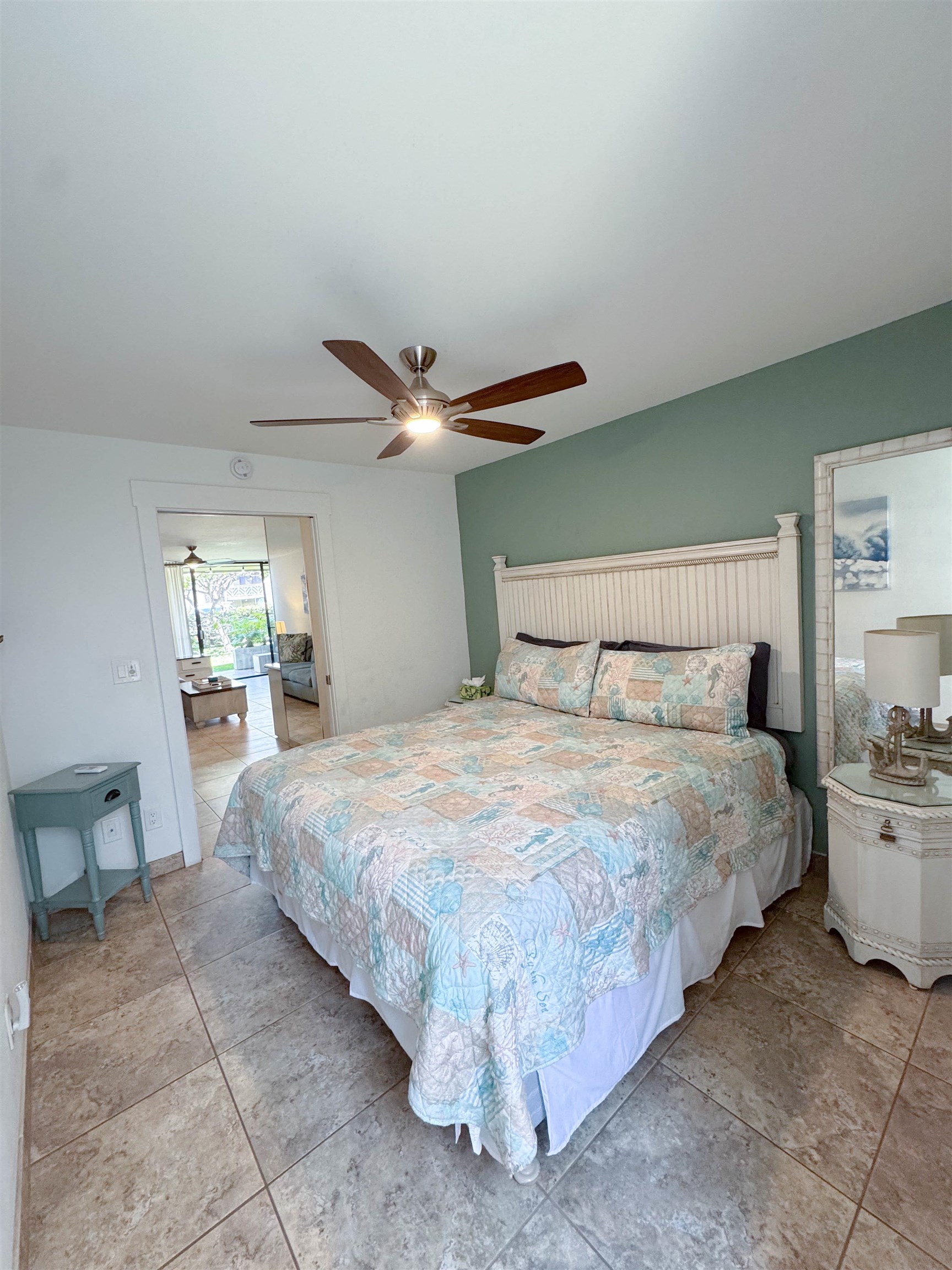 483 South Kihei Road, Unit 115 Kihei, HI 96753 - Photo 15 of 36 a bedroom with a bed and window