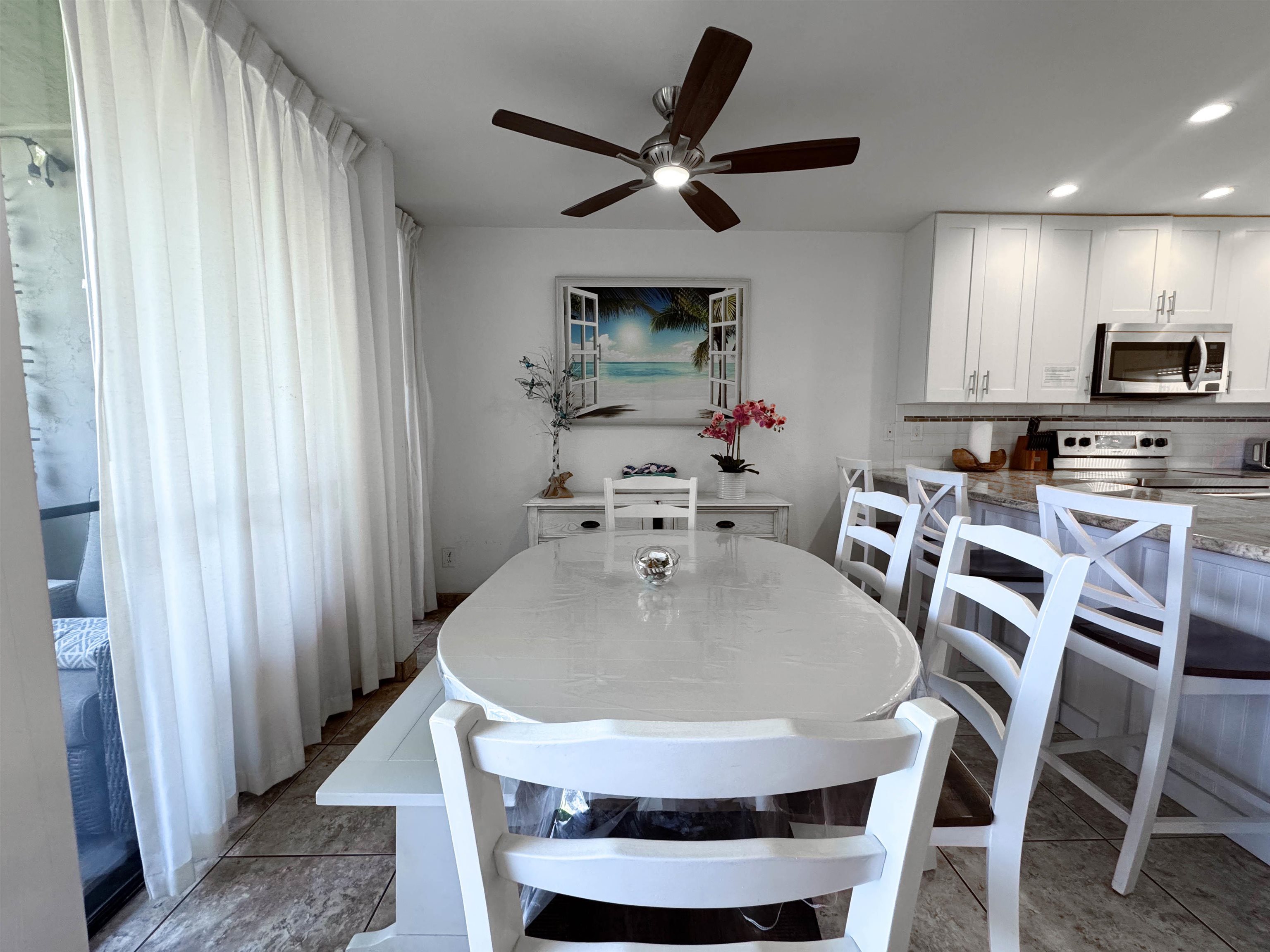 483 South Kihei Road, Unit 115 Kihei, HI 96753 - Photo 10 of 36 a kitchen with furniture and a sink