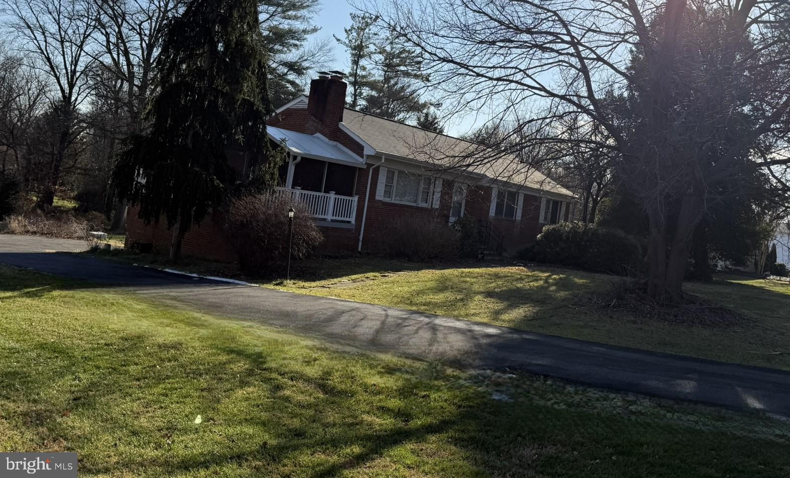 2807 Cedar Lane Vienna, VA 22180 - Photo 2 of 6 a front view of a house with a yard