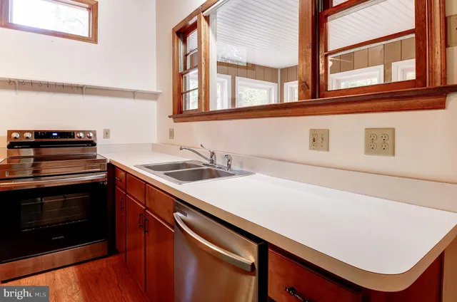 a kitchen with a stove and a microwave