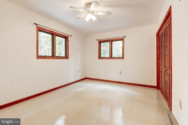 a view of an empty room with a window