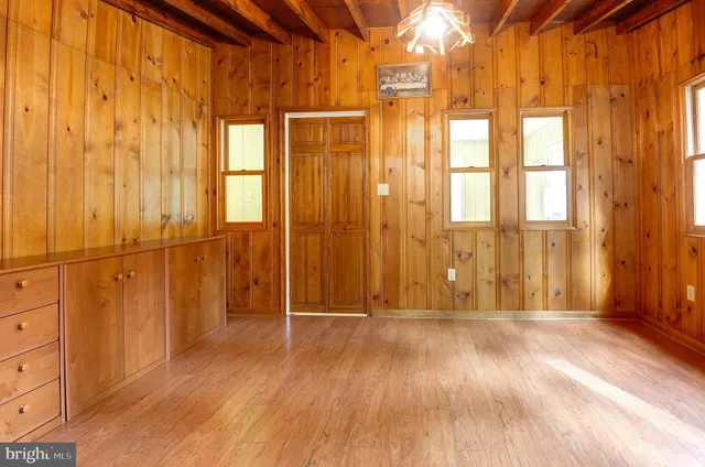 a view of entryway with wooden floor