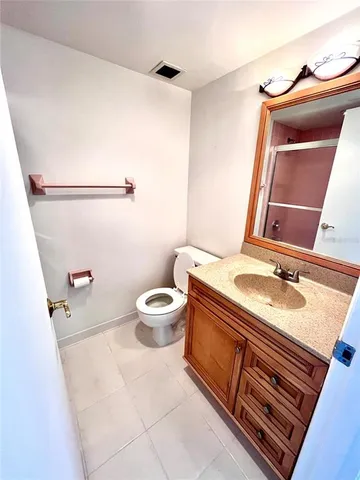 a bathroom with a glass shower door