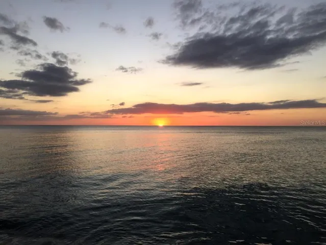 a view of swimming pool with outdoor seating