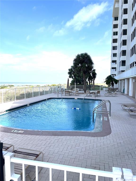 633 Alhambra Road, Unit 703 Venice, FL 34285 - Photo 4 of 15 a view of swimming pool with outdoor seating