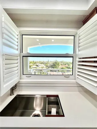 a stove top oven sitting inside of a kitchen