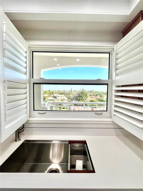 633 Alhambra Road, Unit 703 Venice, FL 34285 - Photo 7 of 15 a view of sink and window in a living room