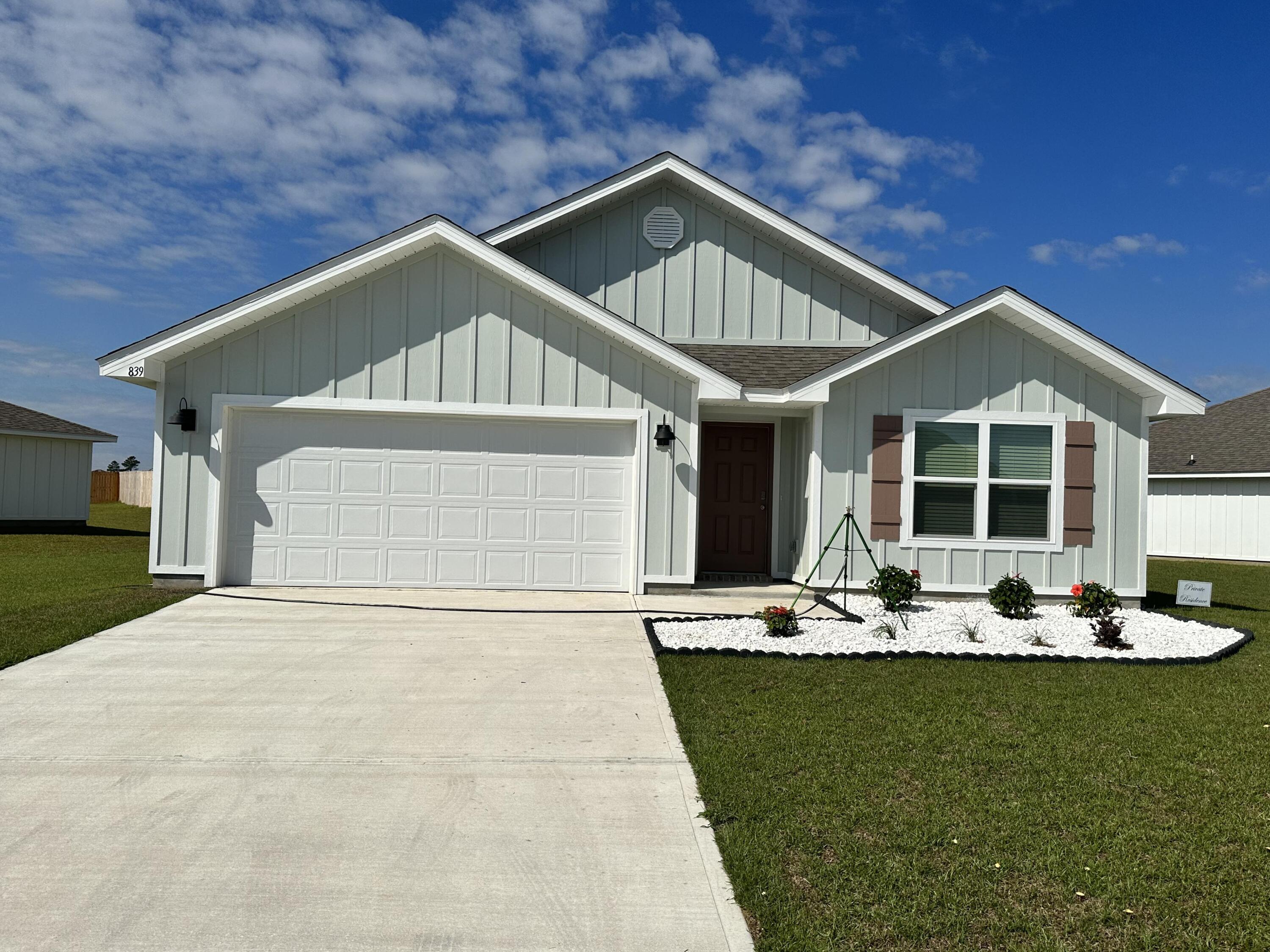 839 Otto Loop Crestview, FL 32539 - Photo 1 of 34 a front view of a house with a yard and outdoor seating