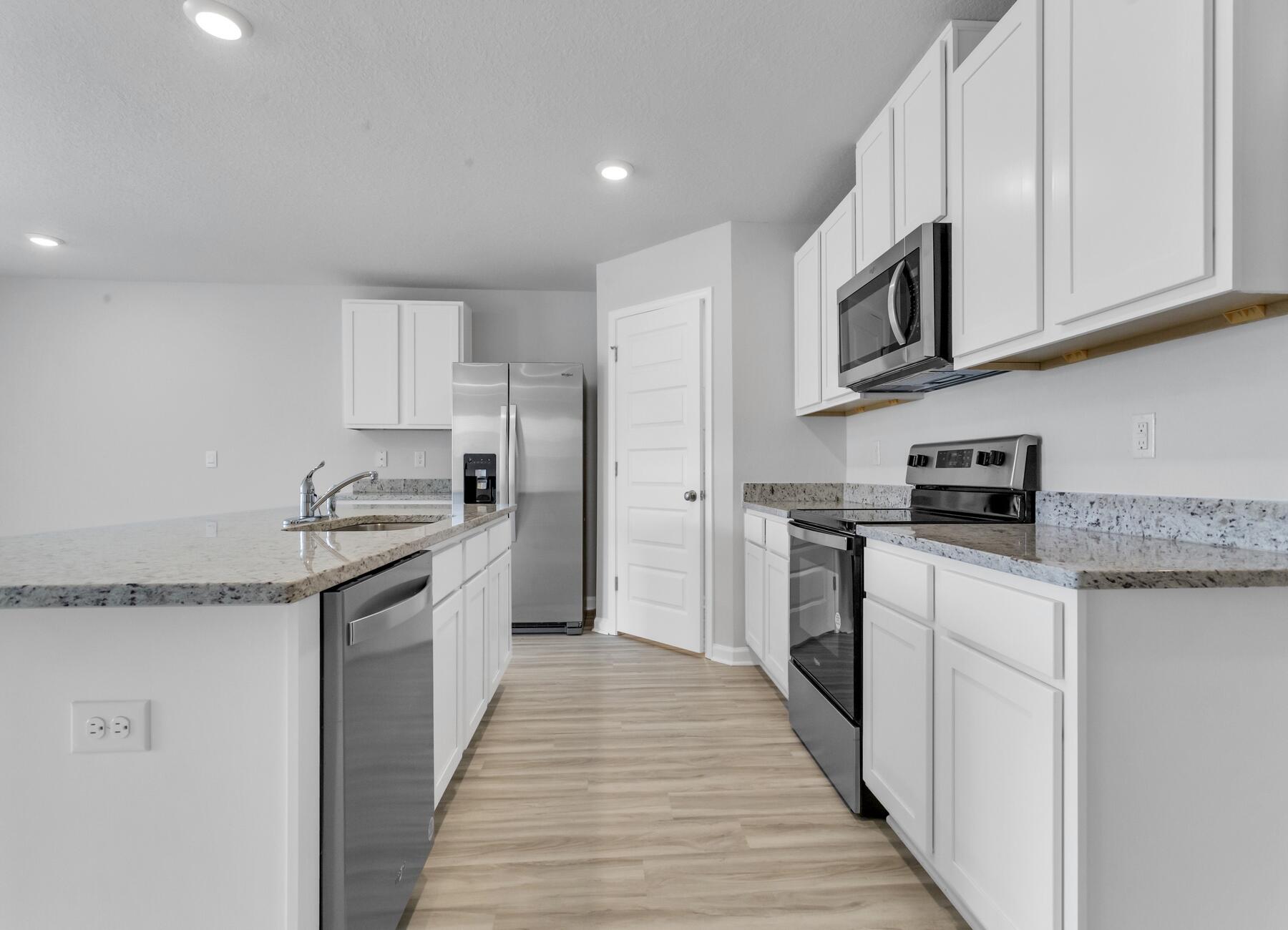839 Otto Loop Crestview, FL 32539 - Photo 17 of 34 a kitchen with granite countertop a sink and steel appliances