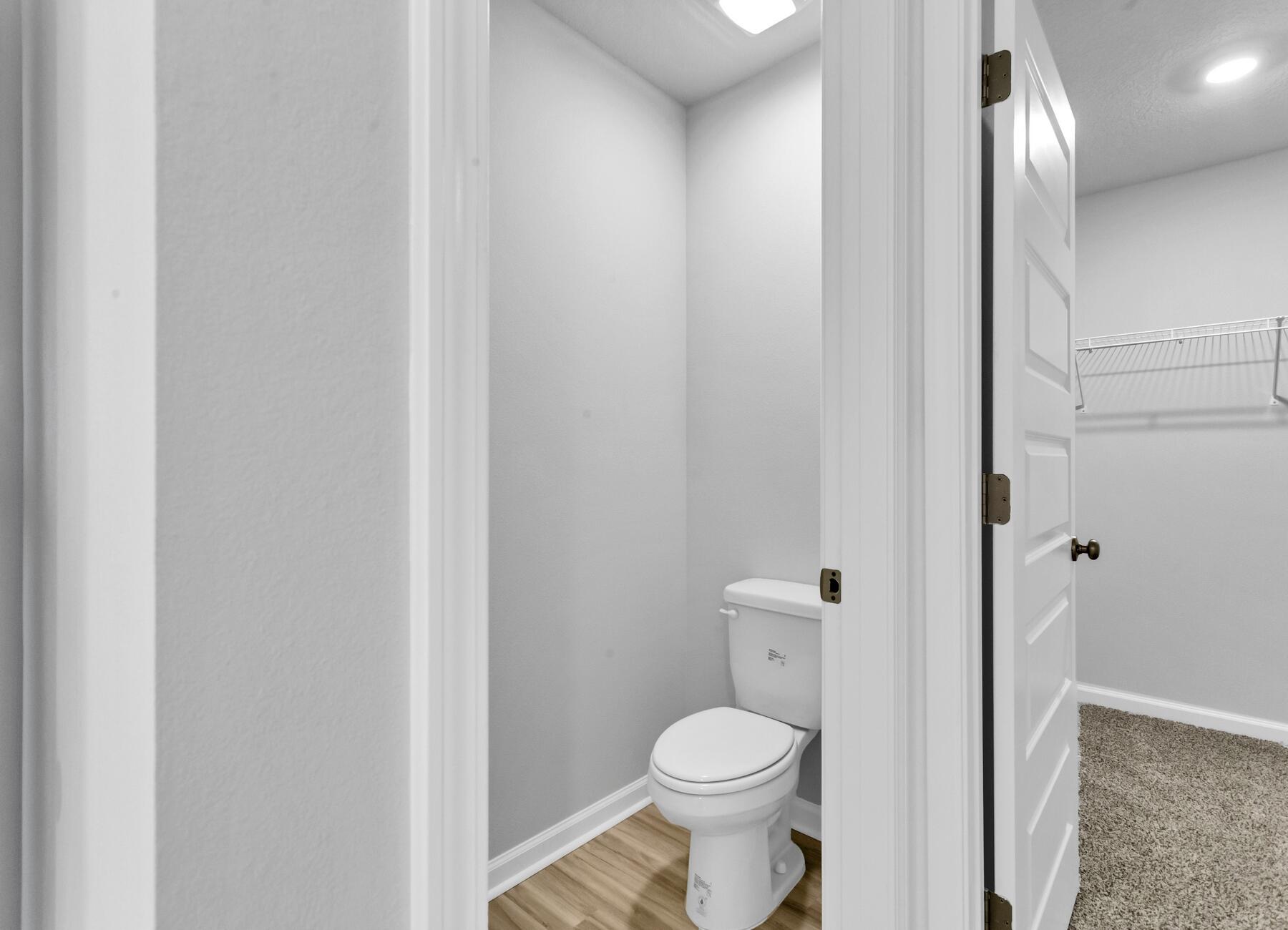 839 Otto Loop Crestview, FL 32539 - Photo 27 of 34 a white toilet sitting next to a bathroom sink