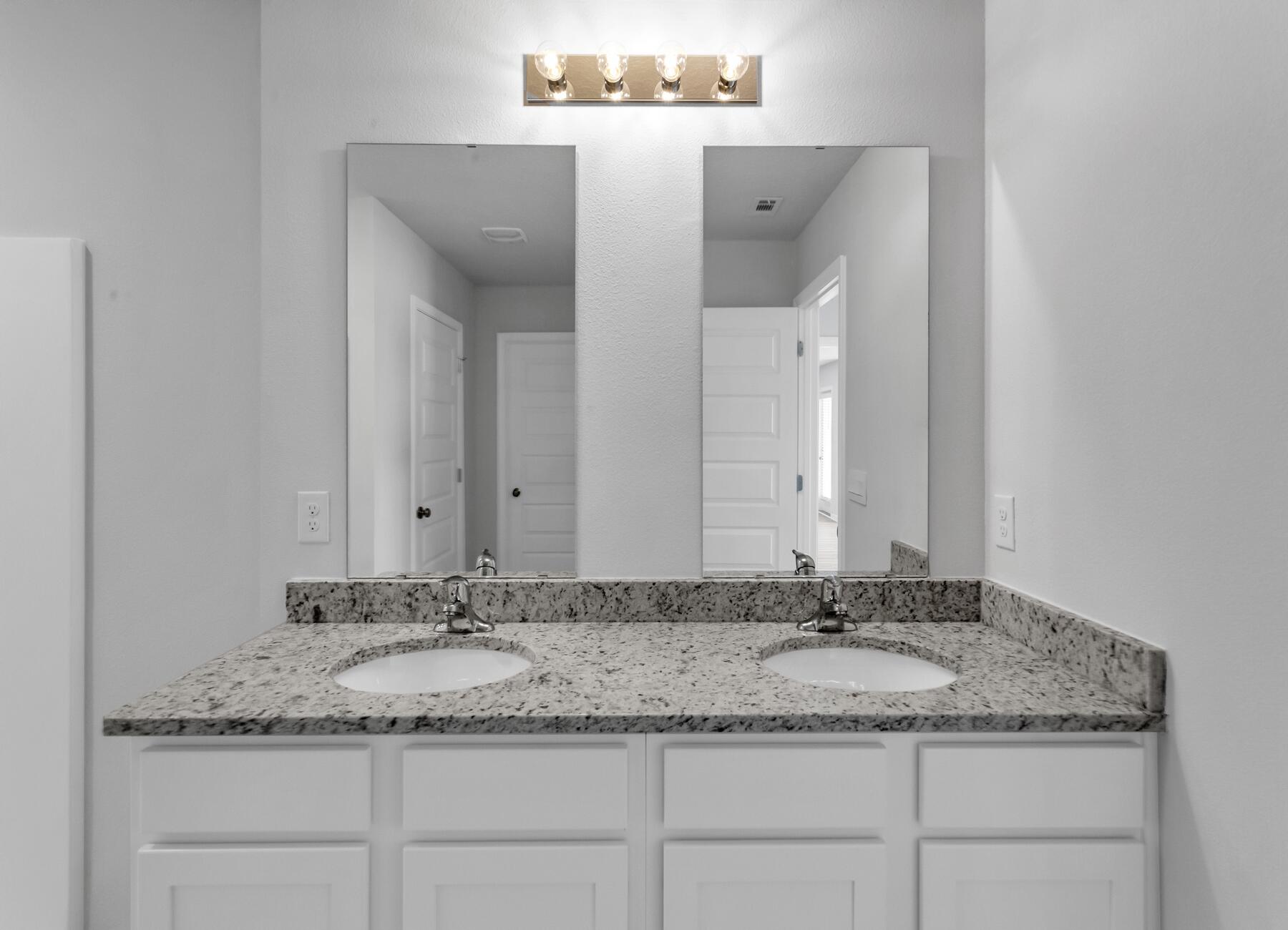 839 Otto Loop Crestview, FL 32539 - Photo 31 of 34 a bathroom with a granite countertop sink and a mirror