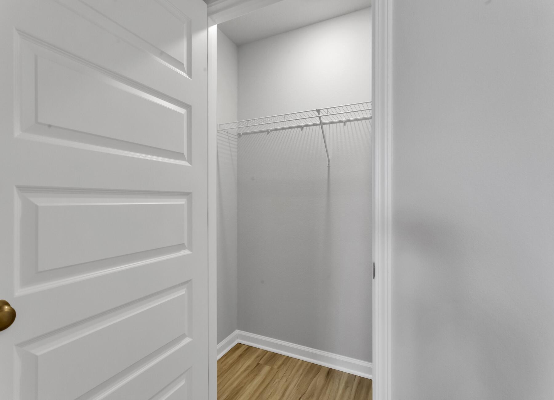 839 Otto Loop Crestview, FL 32539 - Photo 32 of 34 a view of walk in closet with empty racks