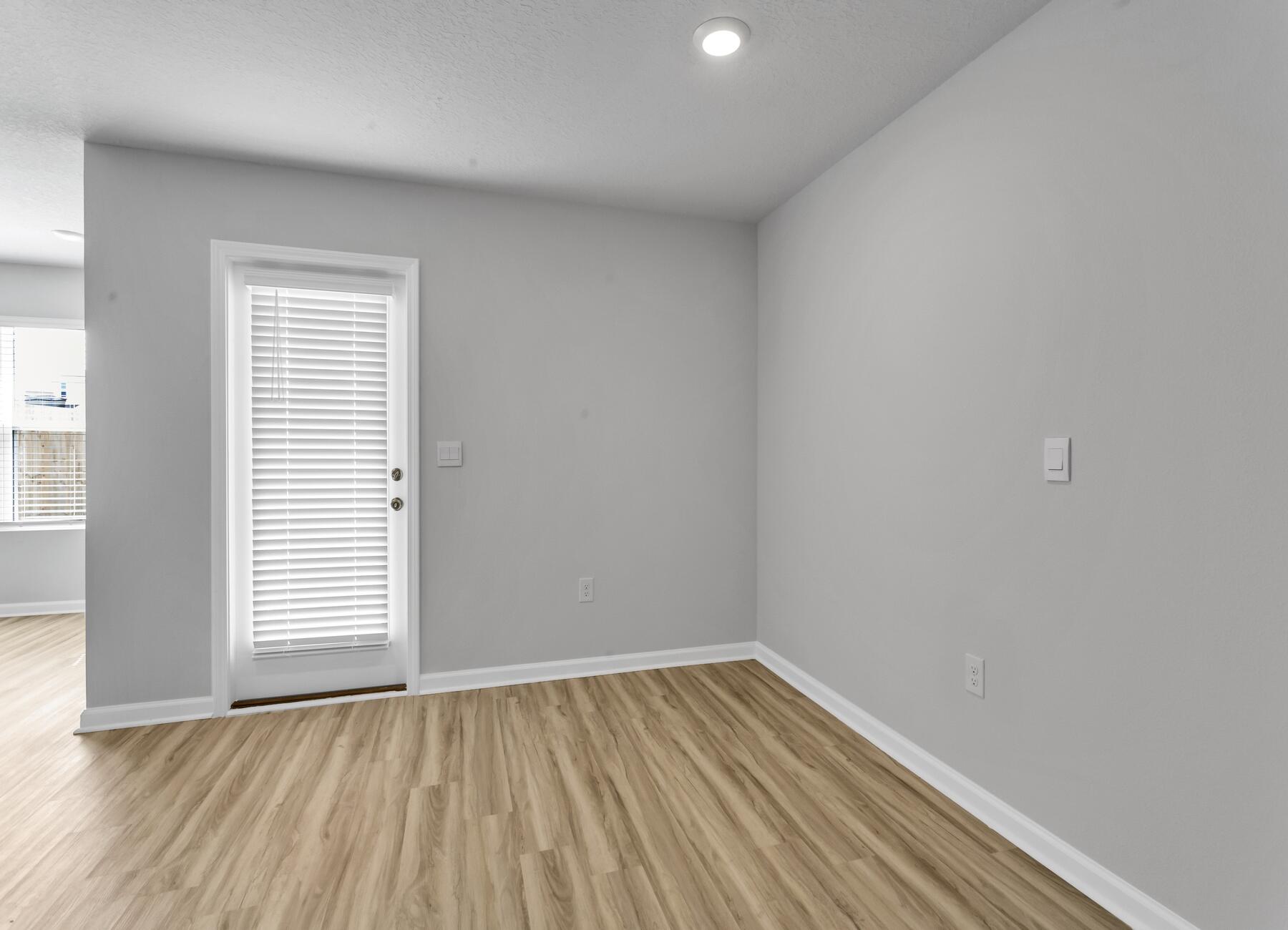 839 Otto Loop Crestview, FL 32539 - Photo 33 of 34 a view of an empty room with wooden floor and a window