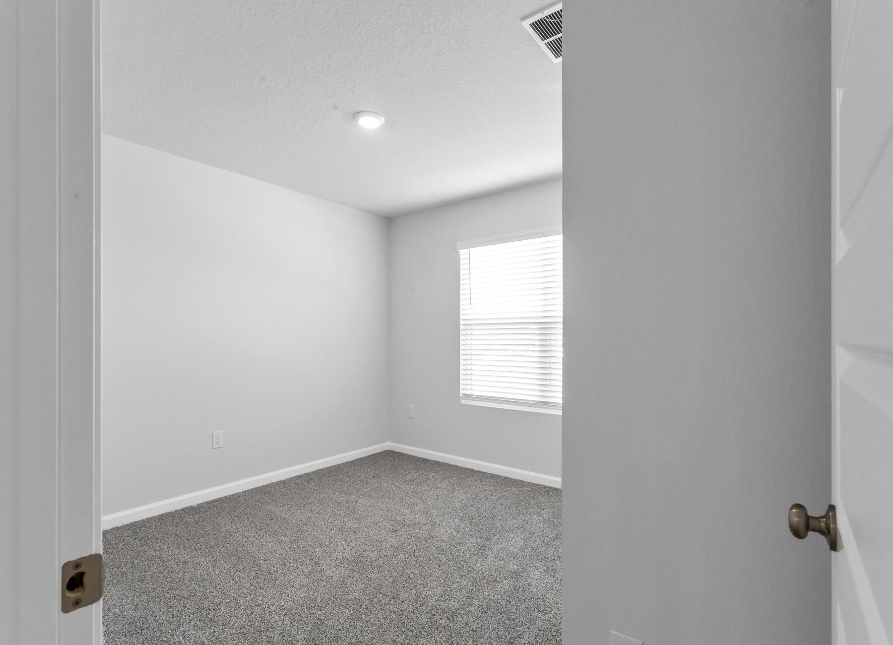 839 Otto Loop Crestview, FL 32539 - Photo 6 of 34 an empty room with a window