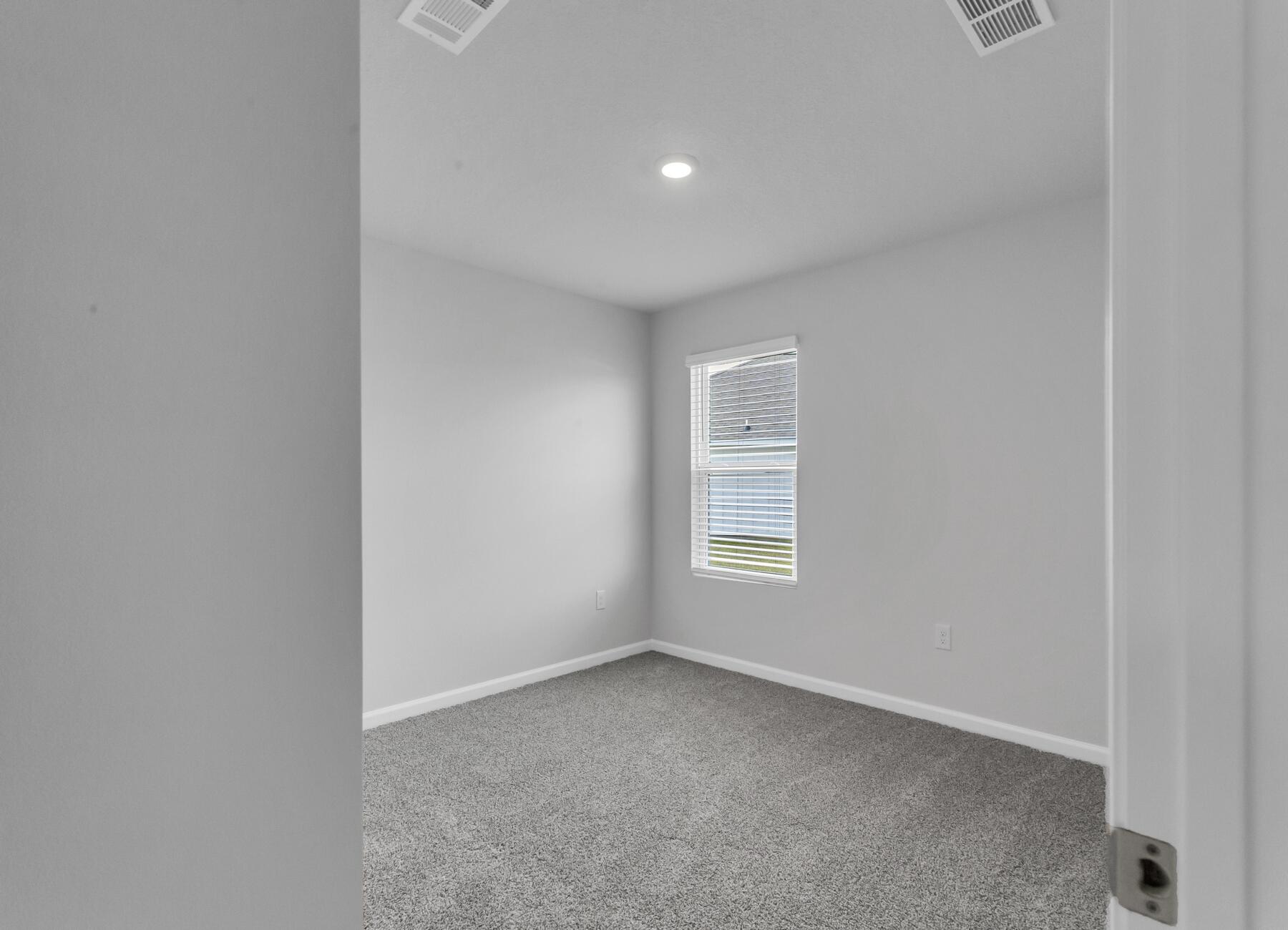 839 Otto Loop Crestview, FL 32539 - Photo 9 of 34 a view of an empty room with a window