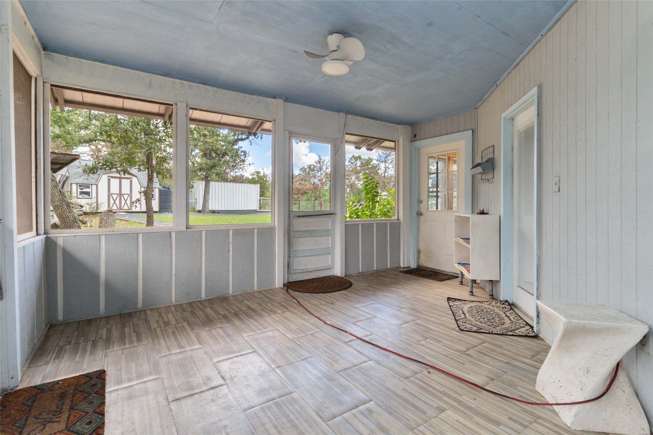 180 Ironstone Road Smithville, TX 78957 - Photo 13 of 37 Unfurnished sunroom featuring a ceiling fan