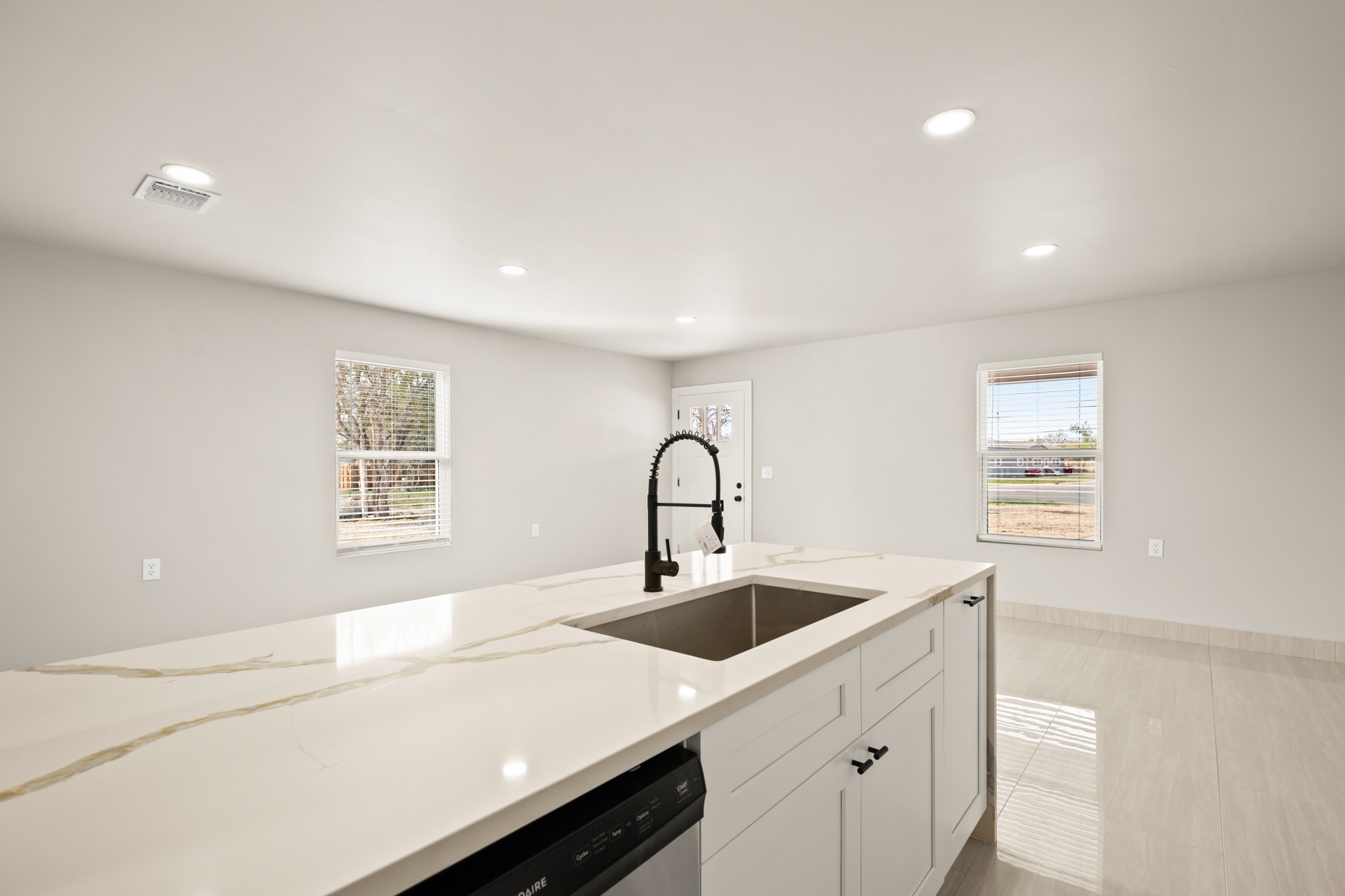 183 Mimosa Road Dale, TX 78616 - Photo 7 of 32 a kitchen with a sink and cabinets