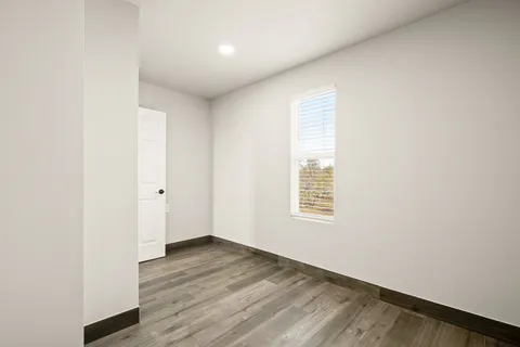 a view of kitchen with kitchen island a sink a center island and a stove