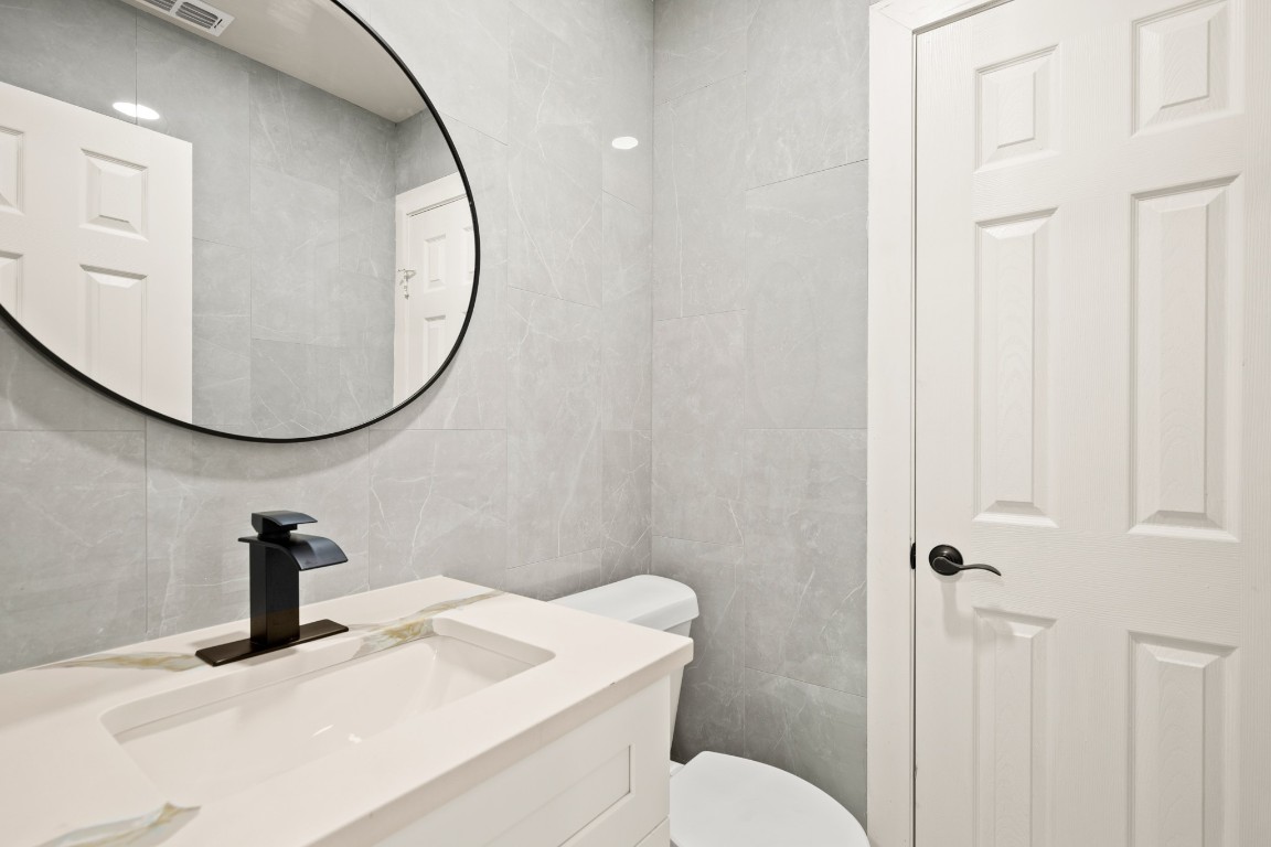 183 Mimosa Road Dale, TX 78616 - Photo 12 of 32 a bathroom with a sink and a mirror