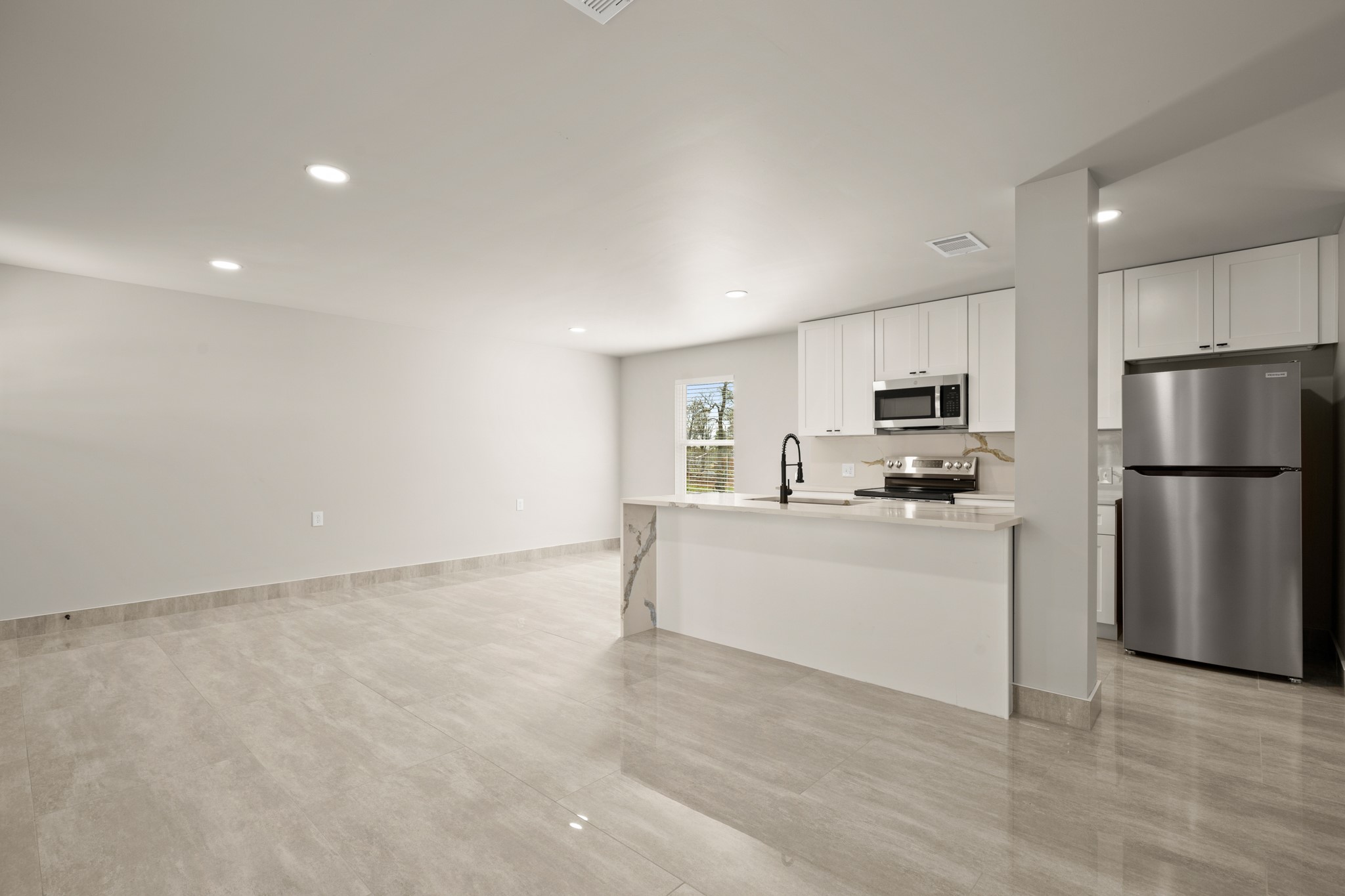 183 Mimosa Road Dale, TX 78616 - Photo 17 of 32 a kitchen with stainless steel appliances a refrigerator sink and microwave