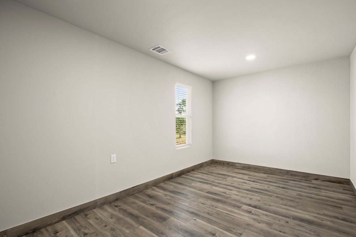 183 Mimosa Road Dale, TX 78616 - Photo 18 of 32 a view of room with window and hardwood floor