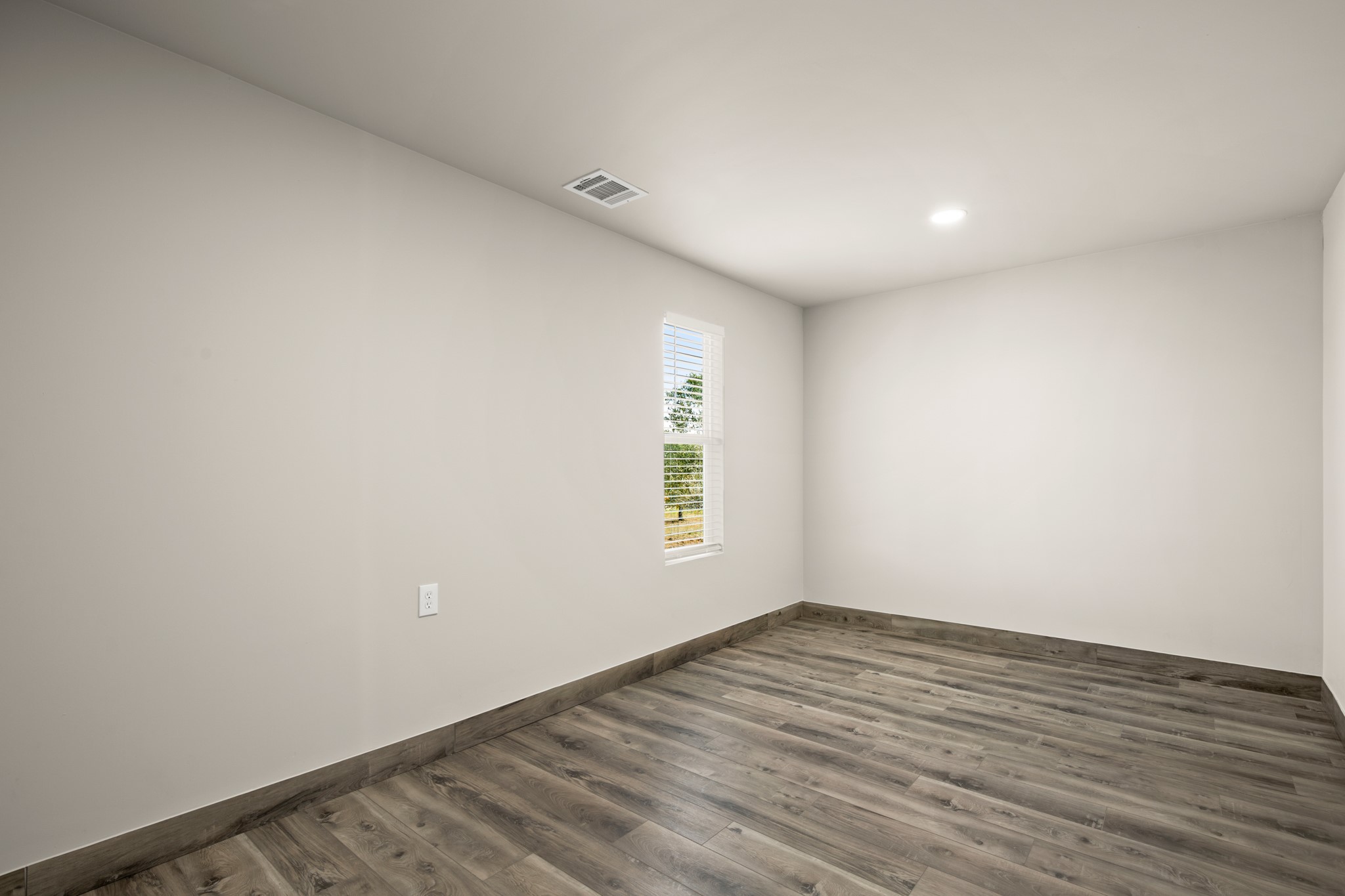 183 Mimosa Road Dale, TX 78616 - Photo 18 of 32 a view of room with window and hardwood floor