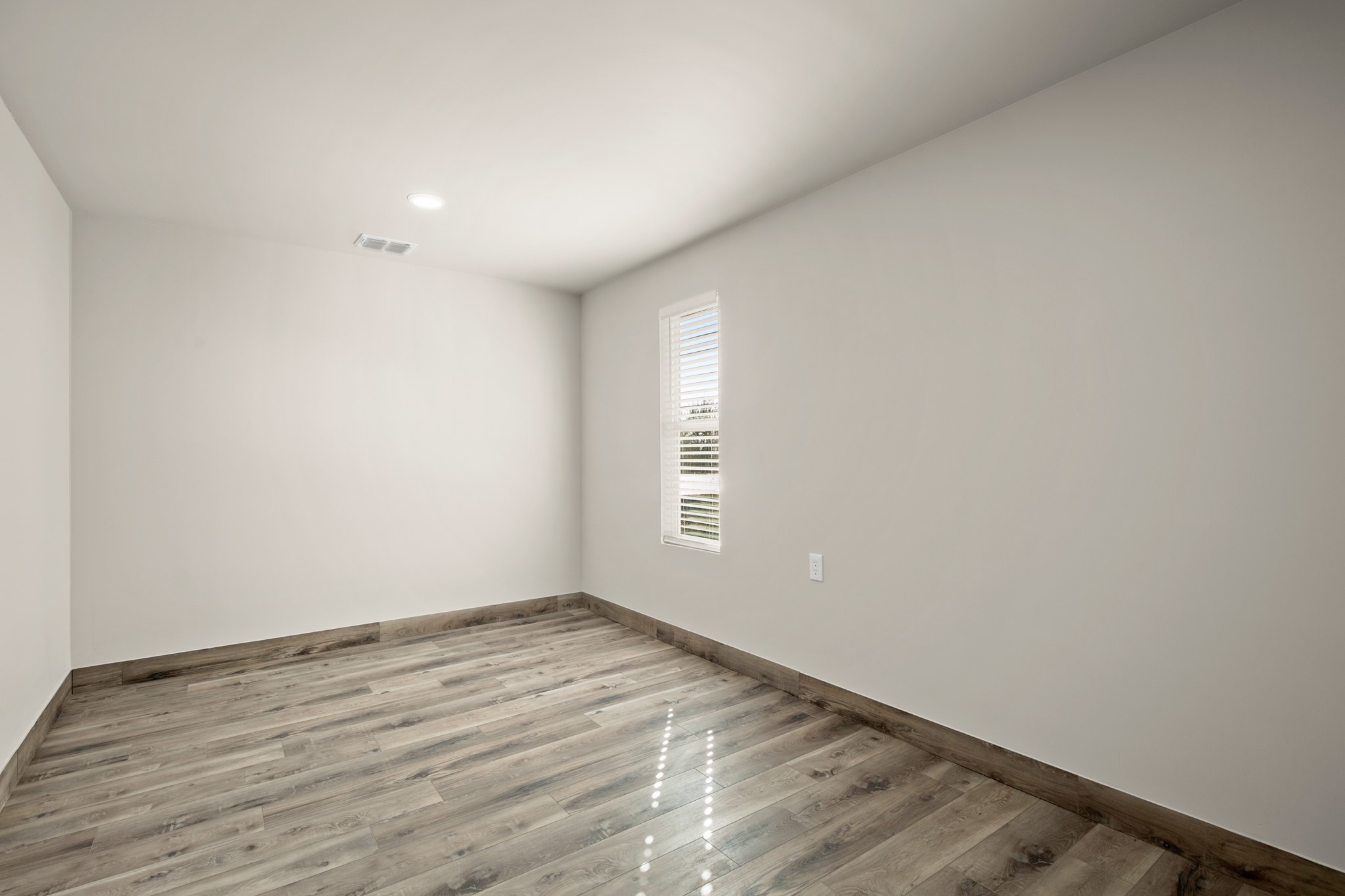 183 Mimosa Road Dale, TX 78616 - Photo 20 of 32 a view of empty room with wooden floor and fan