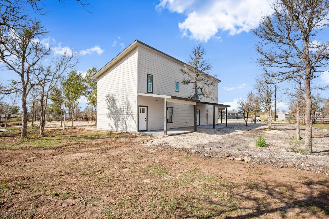 183 Mimosa Road Dale, TX 78616 - Photo 26 of 32 a view of a yard with a house