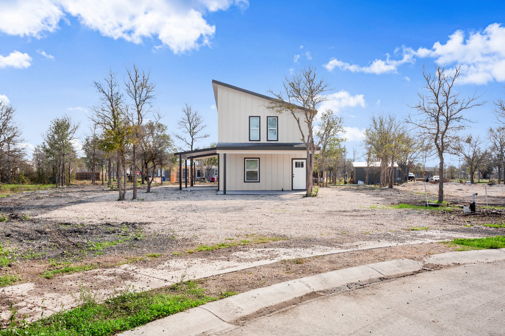 183 Mimosa Road Dale, TX 78616 - Photo 28 of 32 a front view of a house with a yard and garage