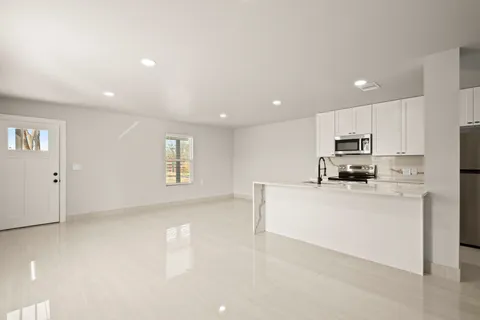 a view of road with large trees