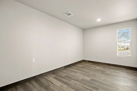 an empty room with white walls and white walls