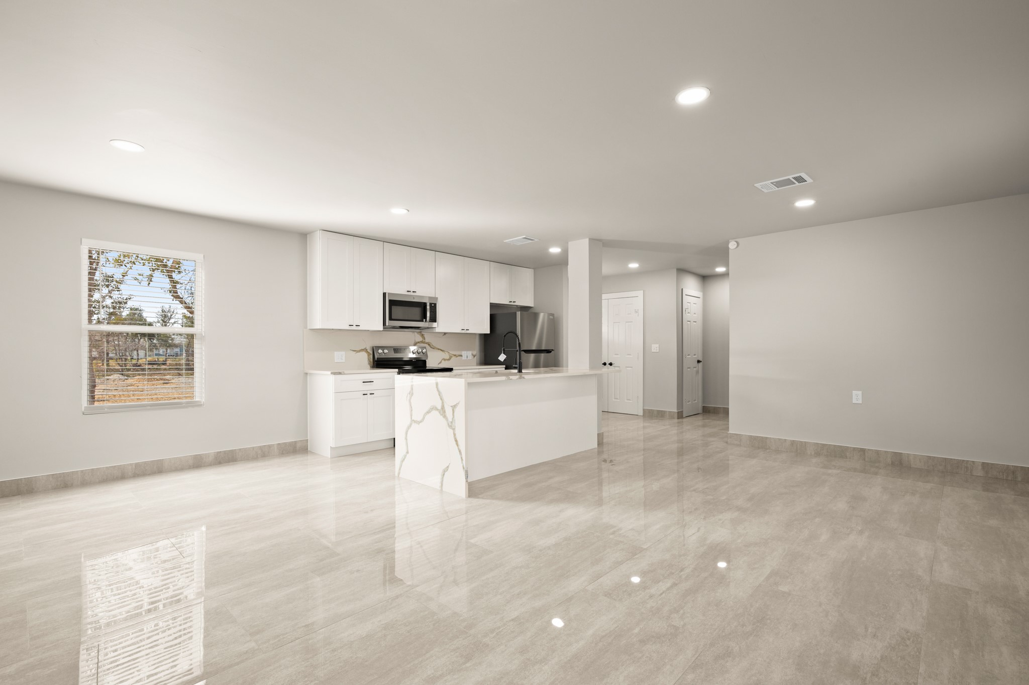 183 Mimosa Road Dale, TX 78616 - Photo 31 of 32 a view of kitchen with stainless steel appliances refrigerator oven and white cabinets with wooden floor