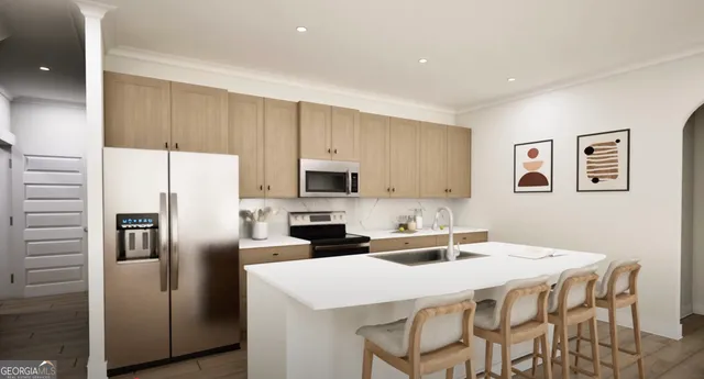 a kitchen with stainless steel appliances a refrigerator sink and microwave