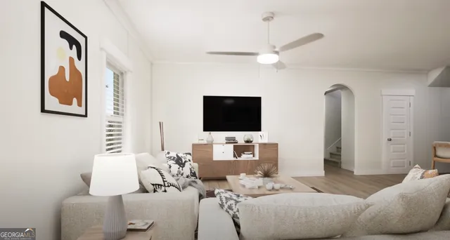 a living room with furniture and a flat screen tv