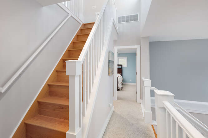 7 Windward Way Ottawa, IL 61350 - Photo 34 of 47 a view of staircase with white walls and railing
