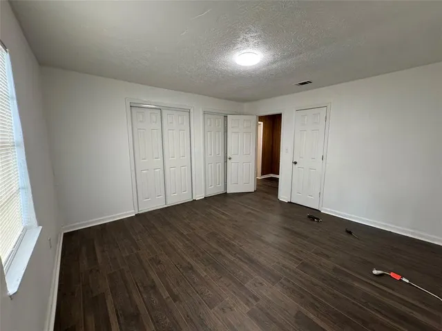 a view of a livingroom with wooden floor