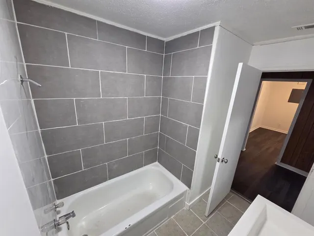 a bathroom with a bathtub