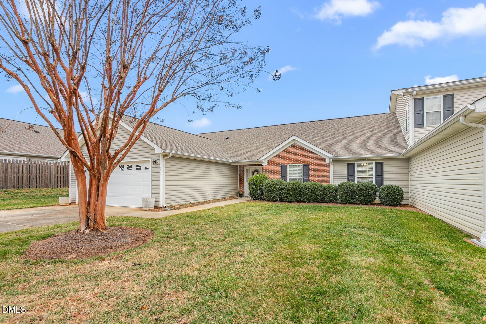 605 Huntingdon Street Elon, NC 27244 - Photo 1 of 18 a front view of house with yard and trees