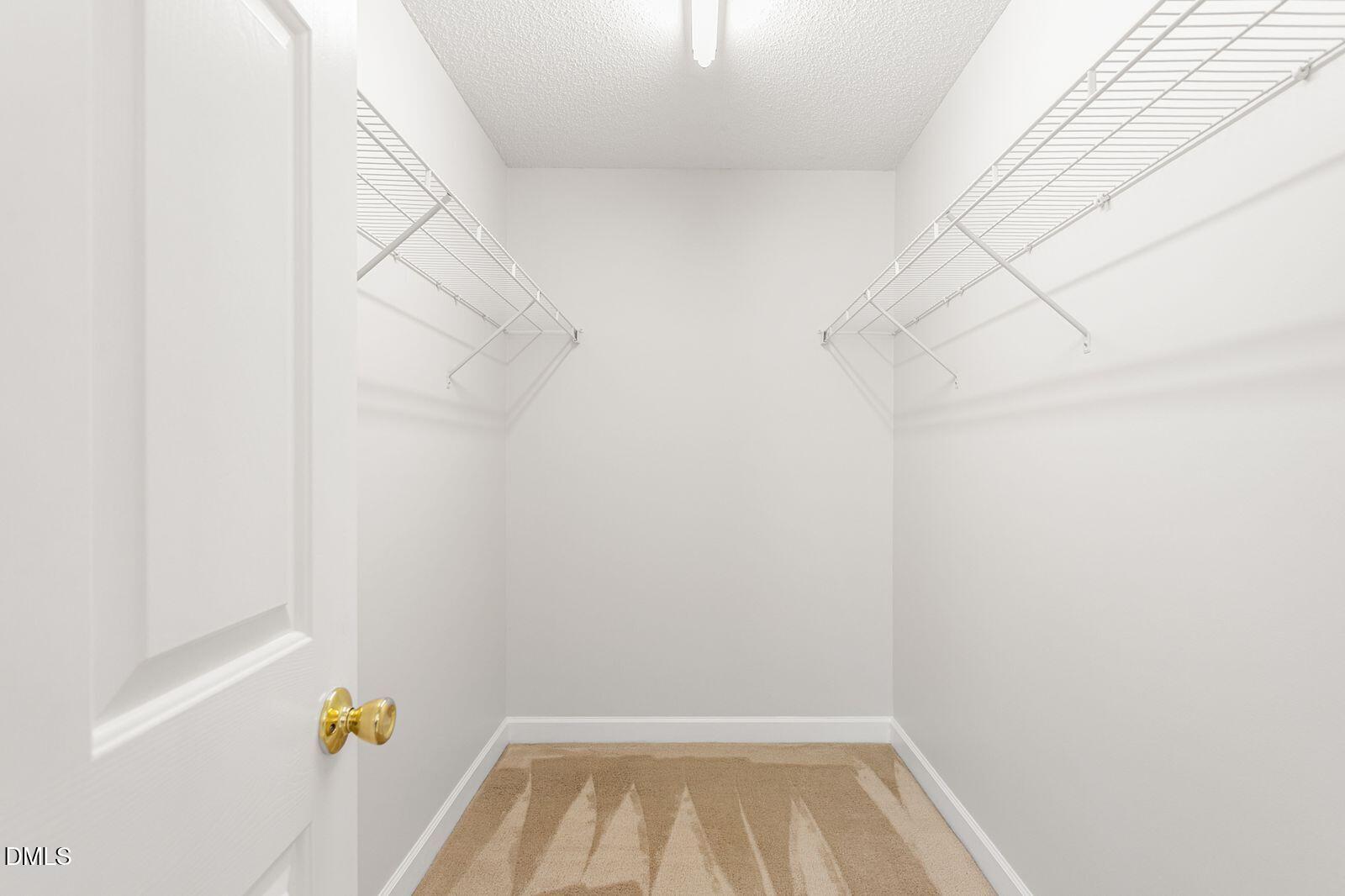 605 Huntingdon Street Elon, NC 27244 - Photo 10 of 18 a view of walk in closet with window