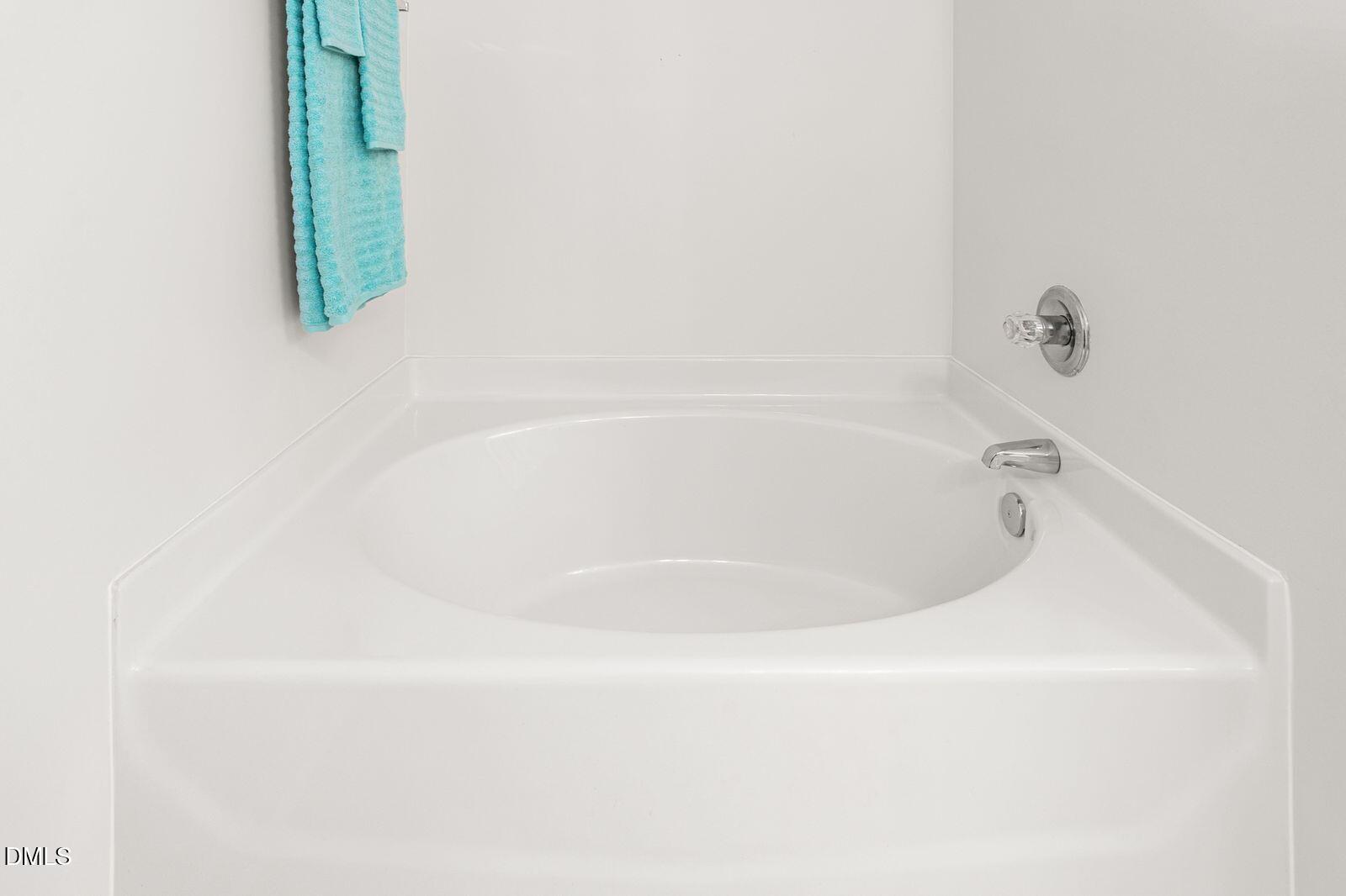 605 Huntingdon Street Elon, NC 27244 - Photo 12 of 18 a white bath tub sitting in a bathroom