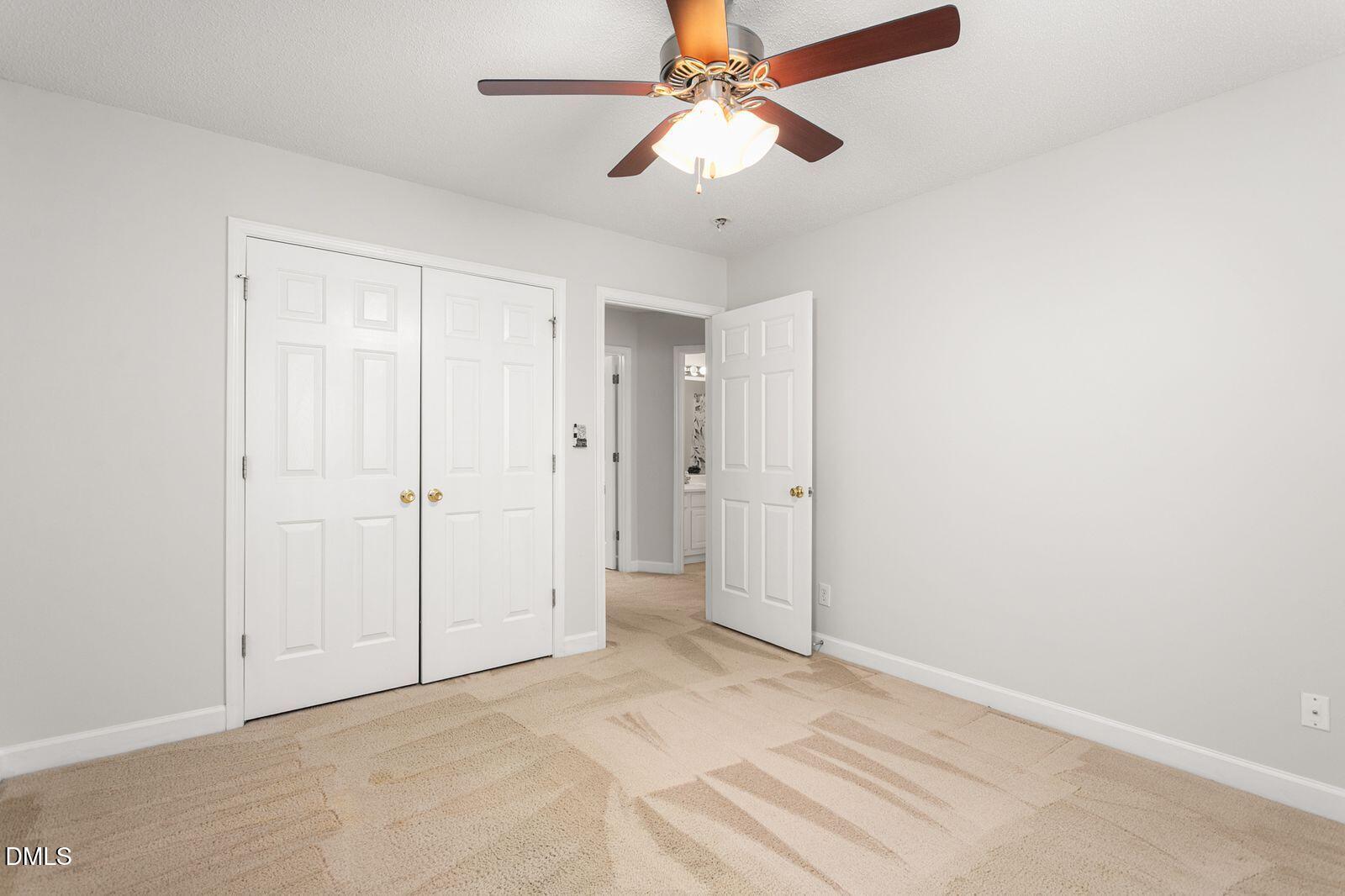 605 Huntingdon Street Elon, NC 27244 - Photo 14 of 18 a view of a room with a ceiling fan