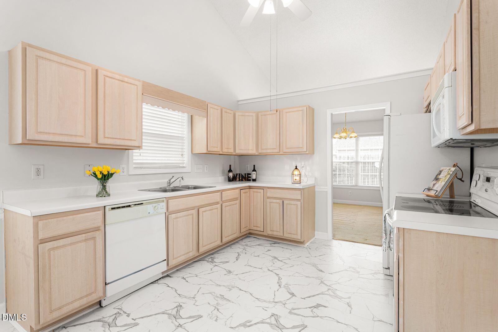 605 Huntingdon Street Elon, NC 27244 - Photo 4 of 18 a kitchen with granite countertop a sink and white cabinets